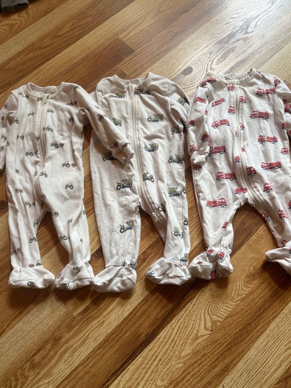 Petit Lem One-Piece Footed Sleepers - 2 tractor Prints and fire trucks 0-3